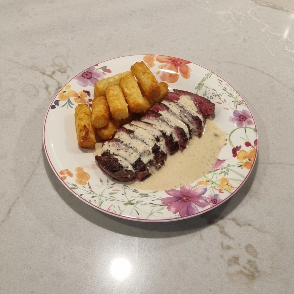 Pepper and cheddar sauce on steack